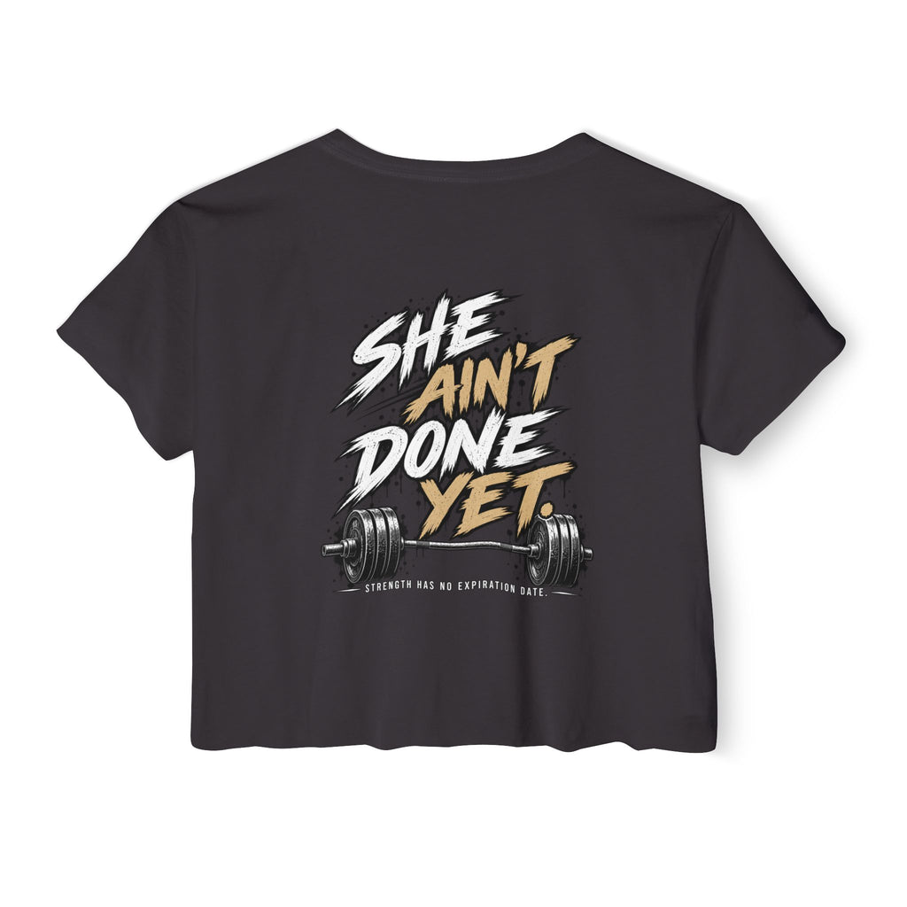 Women's Cropped Tee — "She Ain't Done Yet" Fitness Graphic