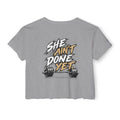 Women's Cropped Tee — "She Ain't Done Yet" Fitness Graphic